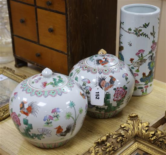 A pair of Chinese lidded jars with cockerel motif and a similar vase